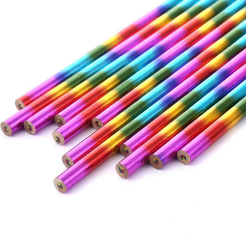 A set of long, vibrant four-colour pencils in shades of pink, blue, green, and gold, arranged in a group.