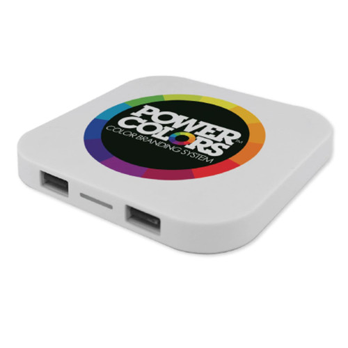A square-shaped white wireless charger featuring a circular multicolour logo. Two USB ports visible on the side.