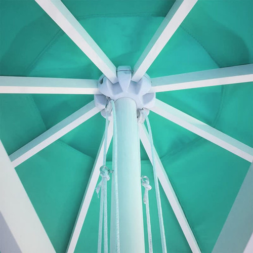 A teal market umbrella featuring a white frame, viewed from underneath, showcasing its structure and ropes.
