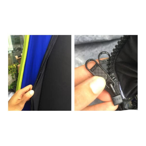 A close-up of a zipper on an inflatable marquee, featuring a black zipper with dual pulls and vibrant blue and green fabric.