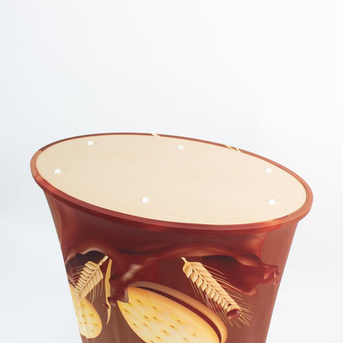 A promotional display counter featuring a chocolate-themed design in brown and beige. It has a round top with holes.