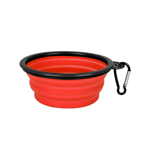 A red collapsible silicon bowl with a black rim and a carabiner clip for easy attachment.