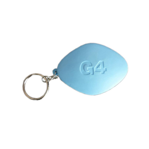 A light blue tablet-shaped stress reliever keyring with a keychain attachment. It features a branding logo on the surface.