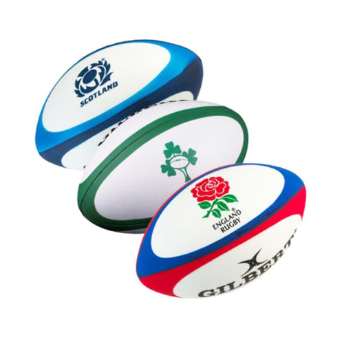 Three stress rugby balls in blue, green, and red, featuring different logos on each.