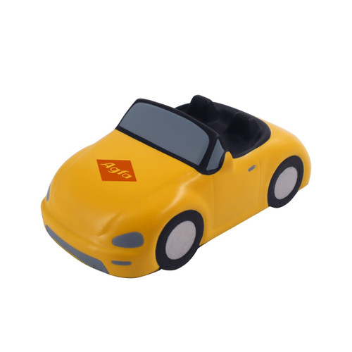 A yellow sports car shape stress reliever with a logo on the hood and black interior details.