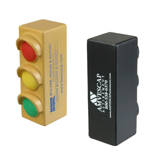 A traffic light shaped stress reliever in red, yellow, and green, alongside a rectangular black stress block.