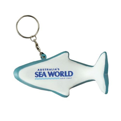 A white dolphin-shaped keyring stress reliever with a turquoise outline and a logo.