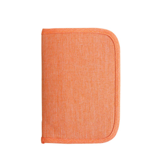 An orange passport holder with a textured finish and rounded corners, featuring a logo.