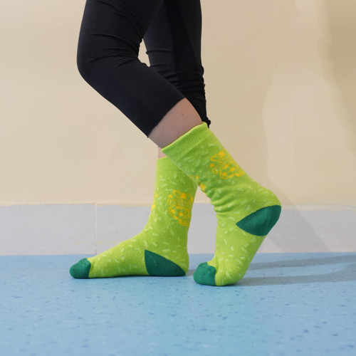 Bright green custom pattern football socks with towel bottom, accented with dark green details.