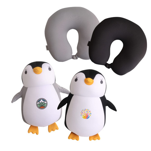 A penguin-shaped travel pillow in black and grey, featuring plush designs with colourful logos on its body.