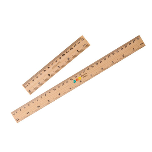 A dual scale wooden ruler featuring metric and imperial measurements, in light natural wood colour. Contains a logo.