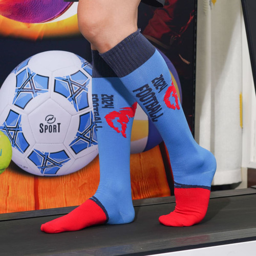Knee-high blue and red football socks with a logo, displayed on a person walking on a treadmill.