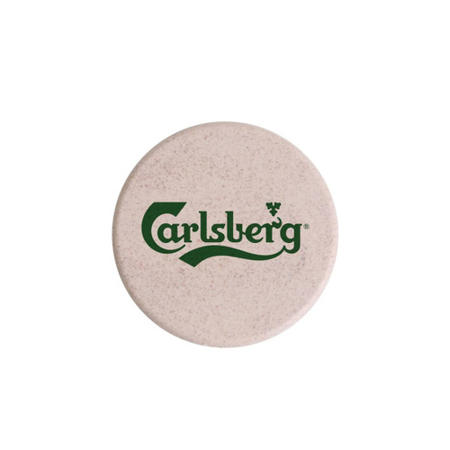 A round wireless charger in a light beige colour with a logo prominently displayed.