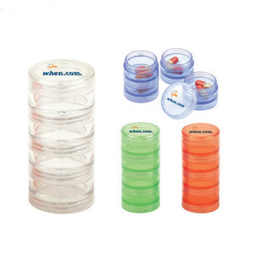 A transparent pill box with multiple compartments in clear, green, and blue colours, featuring a logo.