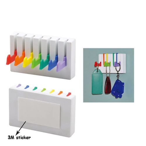 A wall-mounted key holder with multi-coloured hooks and a white base, featuring a 3M sticker on the back.