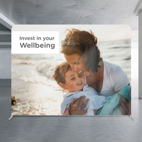 A large media wall featuring a parent and child by the beach, with a light background and a logo.