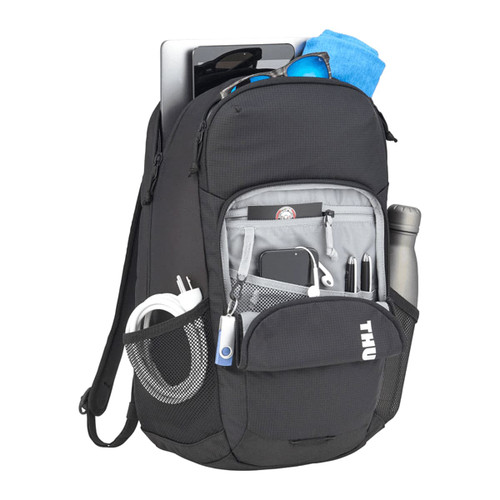 A black laptop backpack with multiple compartments, a drink bottle, sunglasses, and a towel. It features a logo.