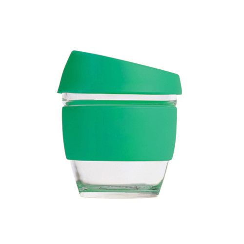 A drink bottle featuring a clear glass body with a green silicone lid and sleeve, perfect for reusable coffee.