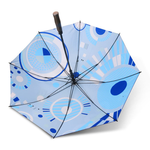 A full colour golf umbrella featuring a geometric pattern in various shades of blue, with a black handle and frame.