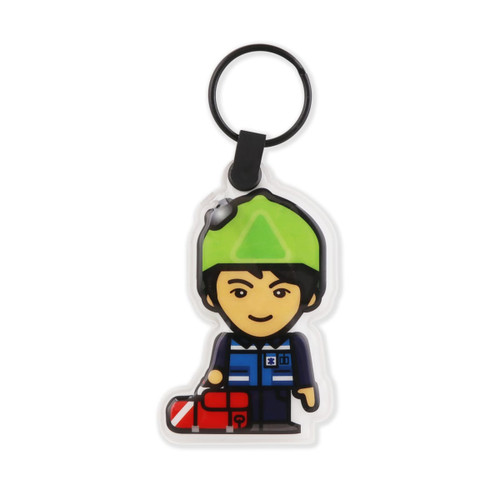 A PVC LED keyring featuring a cartoon figure in a green hat holding a red bag, with a black keyring attachment.