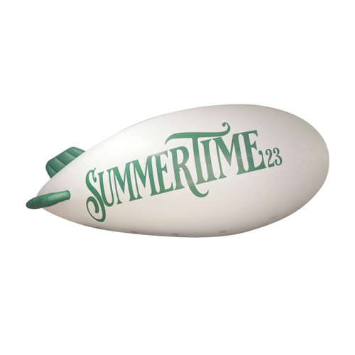 An inflatable blimp in white with green text featuring the word "SUMMERTIME" and a branding logo.