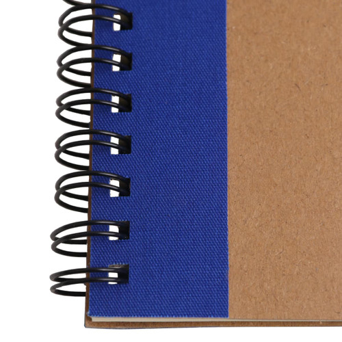 A kraft notebook with a blue cover and spiral binding, featuring a ballpoint pen attached.