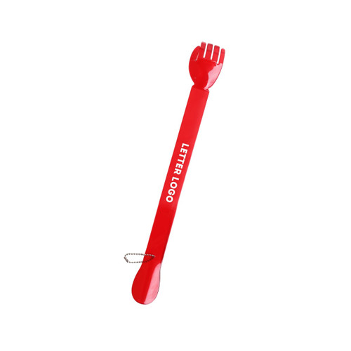 A red back scratcher and shoehorn with a forked end and a circular handle, featuring a logo.