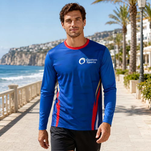 A long-sleeved t-shirt in blue with red accents, featuring a logo, designed for sun protection.