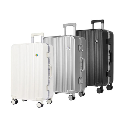 A collection of three ribbed ABS suitcases in white, silver, and black with wheels and handles. Each has a logo.
