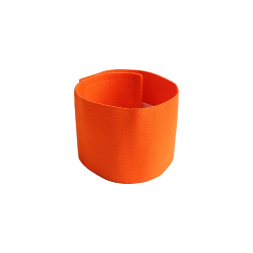 An orange stretchy armband, featuring a textured surface and a sleek design.