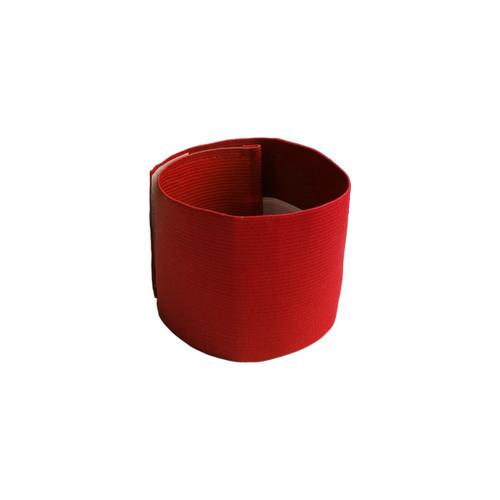 A red stretchy armband featuring a simple design with a textured finish and an interior lining.