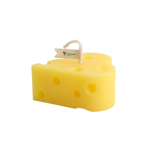 A yellow heart-shaped candle resembling a cheese wedge, featuring a small flag and holes throughout.