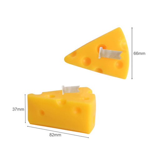 Triangle-shaped candles in a bright yellow hue, resembling cheese, with a small decorative flag on top.