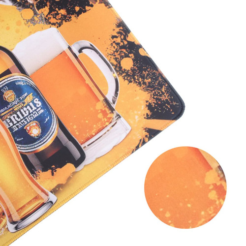 A rubber counter mat features a vibrant design with images of beer bottles and glasses in shades of yellow and orange.
