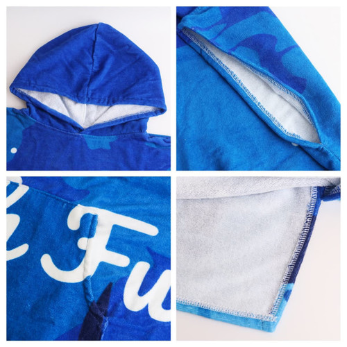 A blue cotton surf poncho featuring a hood and soft inner lining, with a logo and decorative patterns.
