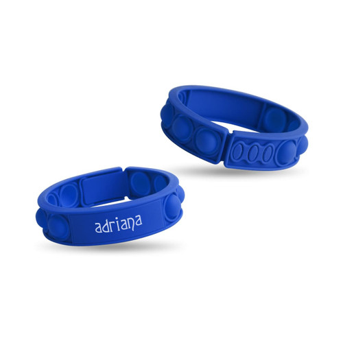 Two blue silicone wristbands featuring raised bubbles and a logo on one band.