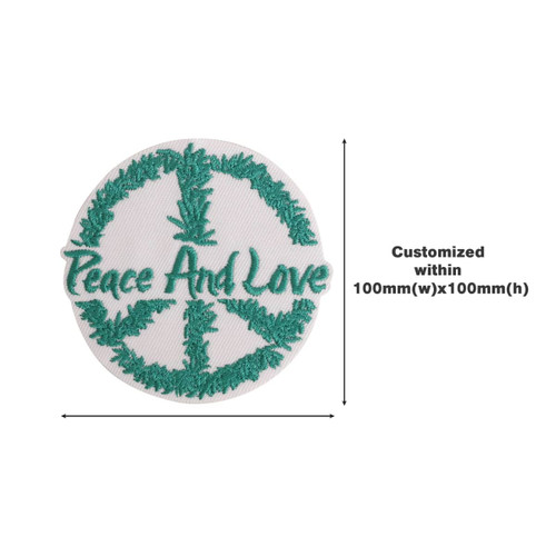 A circular woven patch featuring a peace sign surrounded by green foliage and the text "Peace And Love" in green.