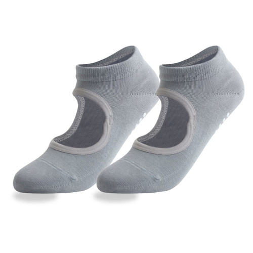 A pair of light grey open top yoga socks featuring a logo and non-slip grip on the sole.