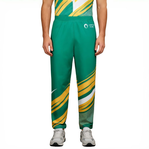 Unisex adult pants made of 100% polyester, featuring a green and gold design with a logo. Sports shorts style.