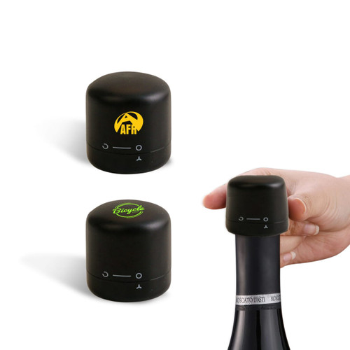 A drink bottle stopper set in black, featuring two designs, one with a logo and one plain, being placed on a bottle.