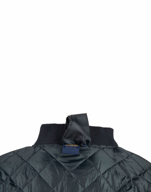 A dark green soft shell jacket with a quilted design and a ribbed collar, featuring a hanging loop at the back.