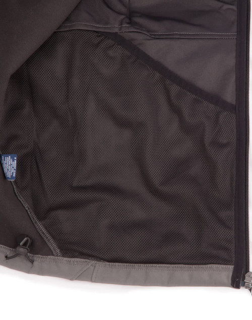 An inside view of a men's softshell high-tech jacket featuring a mesh pocket, predominantly grey in colour.