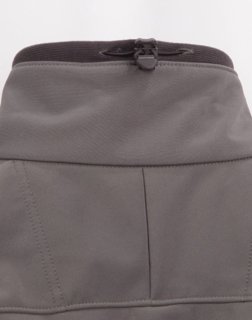 A grey ladies softshell hi-tech jacket featuring a high collar and adjustable cord at the neckline.
