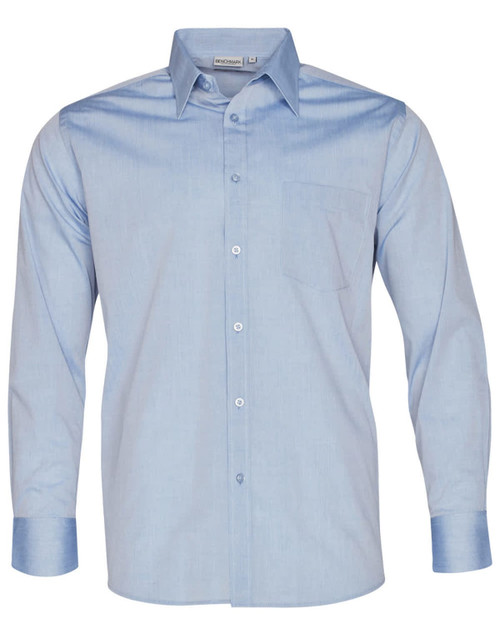 A light blue long sleeve chambray shirt with a button-up front and a pocket on the chest. It features a logo tag.