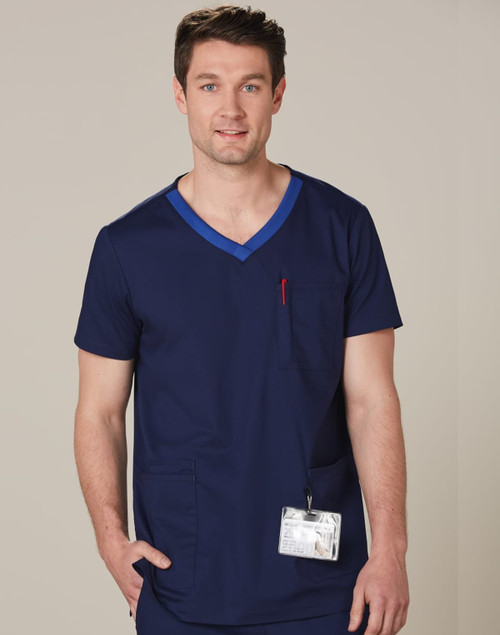 A men's scrub top in navy blue with a contrast blue neckline, featuring a chest pocket and a logo.