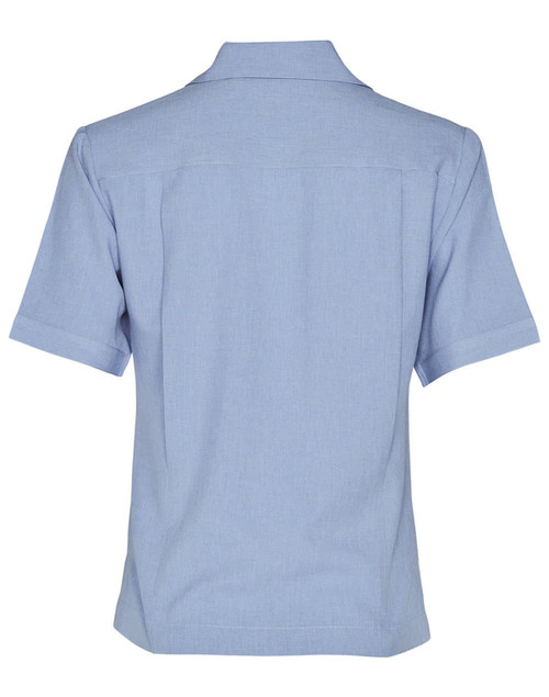 A light blue short sleeve overblouse featuring a collared neckline and a logo. Suitable for uniforms and tunics.