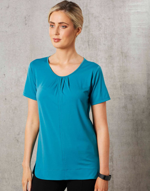 Teal ladies' round neck knit top with pleats and short sleeves, featuring a logo. Smooth fabric and a relaxed fit.