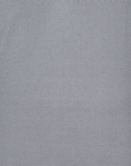A textured grey polo shirt featuring a subtle pattern and a logo on the chest.