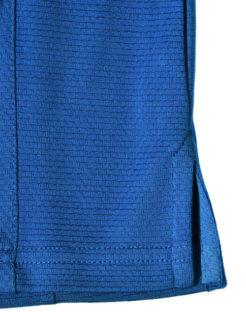 A blue bamboo charcoal polo shirt featuring a textured pattern and side slits, with a logo.