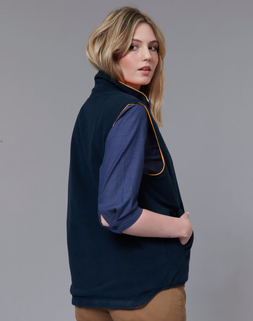 A reversible safety vest in navy with orange piping, featuring a high collar and arm openings. It has a logo.